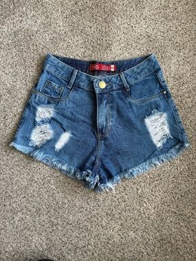 High-Rise Distressed Denim Shorts in Dark Blue